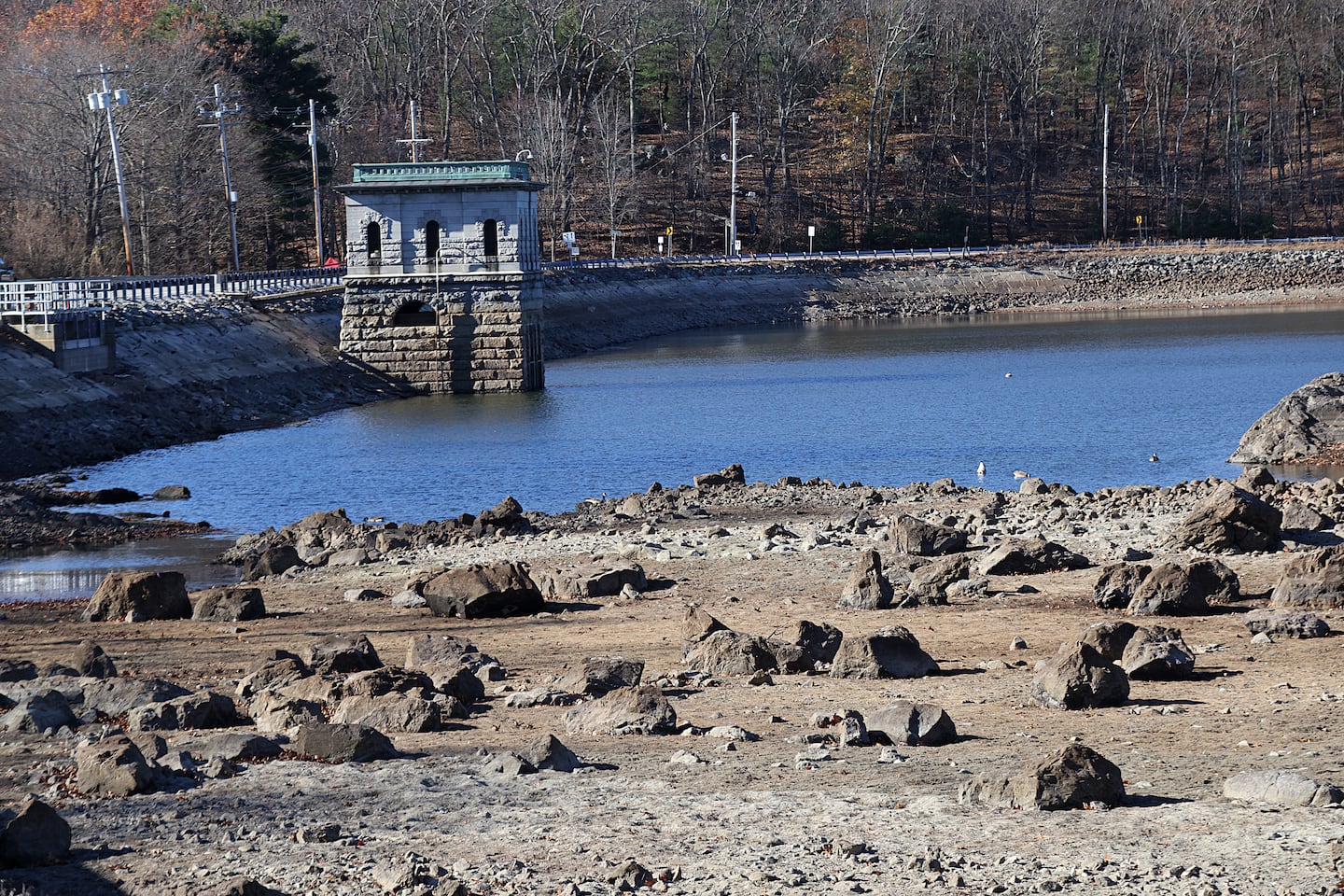 Part of the exposed bed of the Cambridge Reservoir in Waltham as seen on Friday.