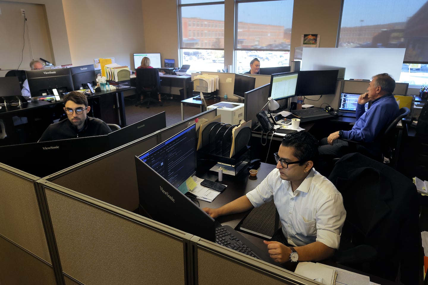 Staff in the accounting department at Lupoli Companies in Lawrence are back in the office five days a week.