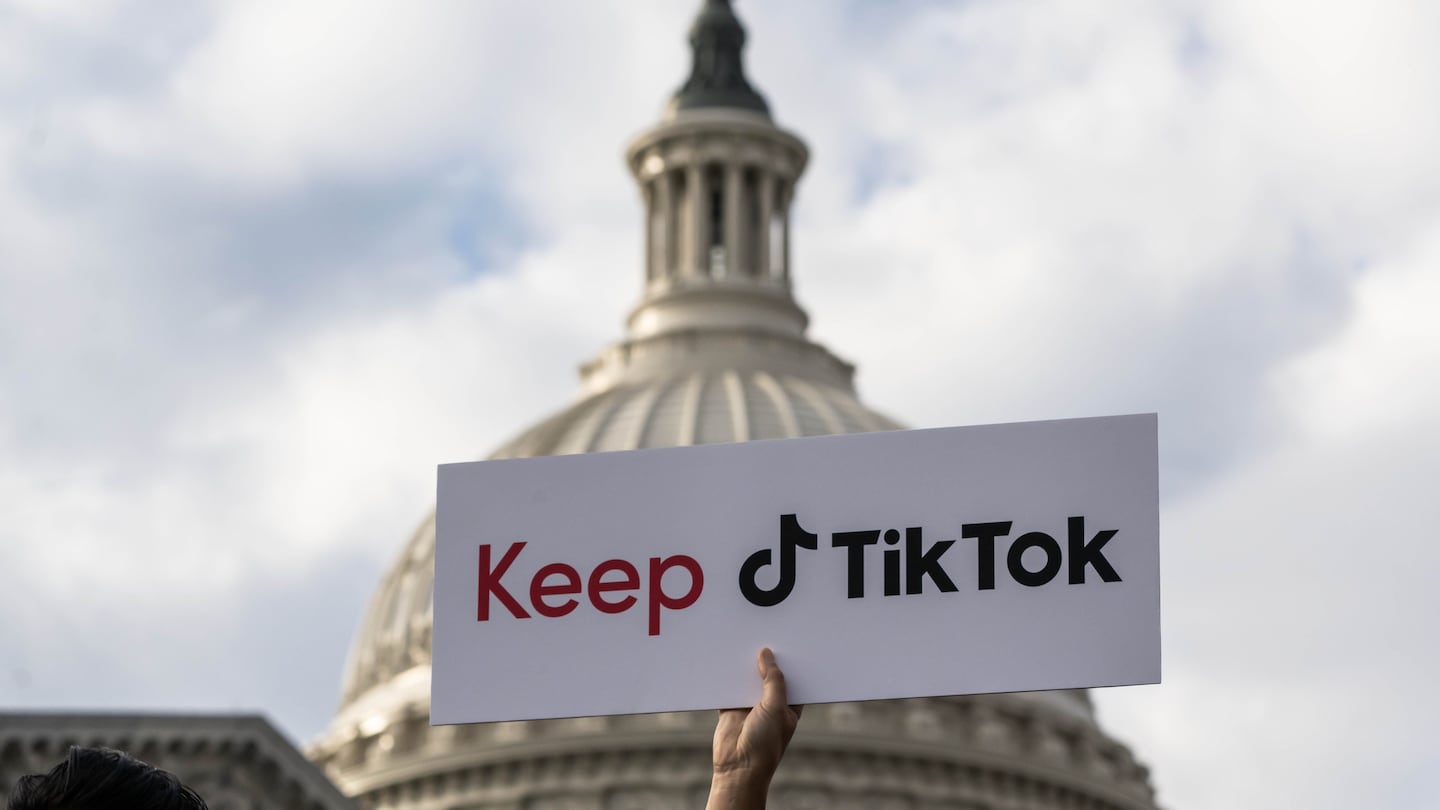 A TikTok creator held a sign supporting the company during a news conference outside the US Capitol in Washington, in March 2023.