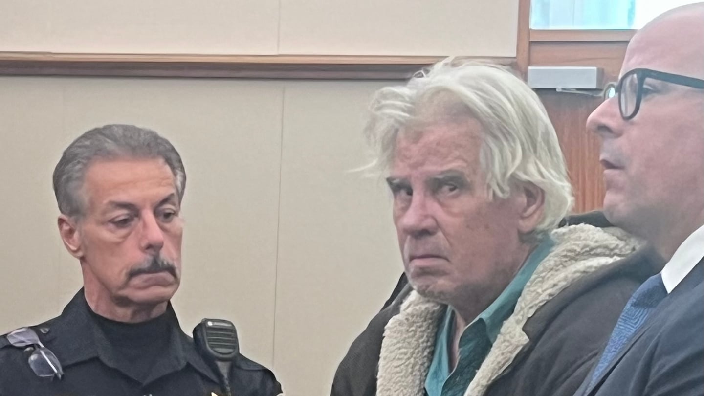 Mark Perkins, 64, of Warwick, is arraigned Nov. 20 on a charge of murder of Charlotte Lester. His lawyer, John Calcagni, stands beside him in Kent County District Court.