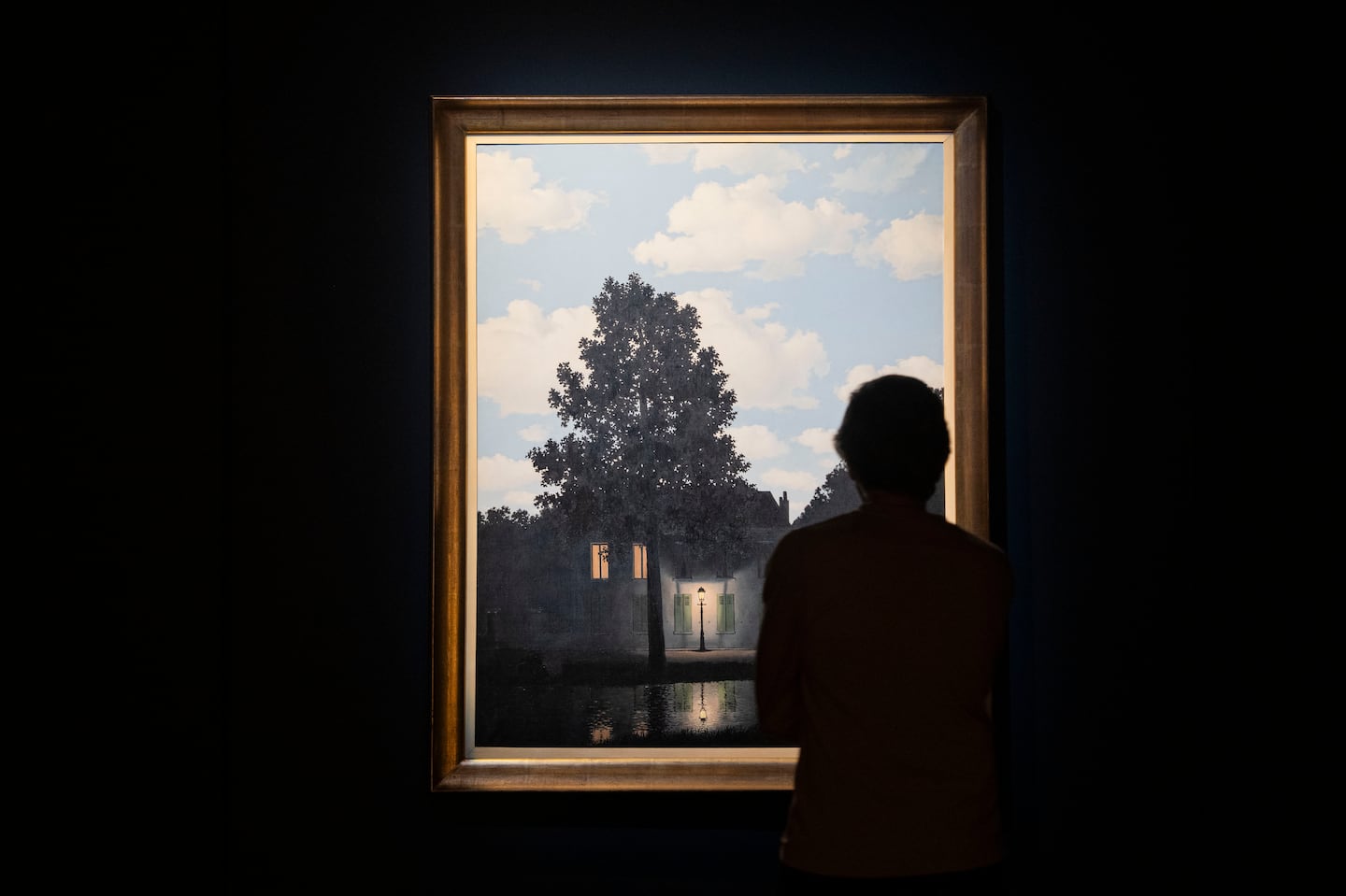 The painting “Empire of Light" by René Magritte, in an auction preview show at Christie’s in Midtown, Manhattan.