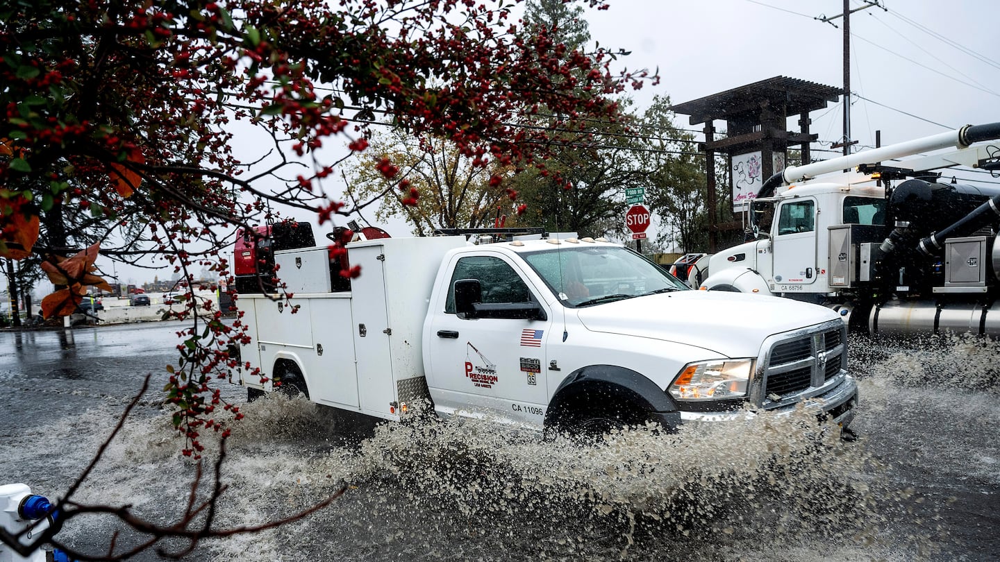 A truck crosses a flooded road, Nov. 20, in Santa Rosa, Calif.