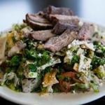 The Salamehs collaborate to run their renovated Cafe Barada. Claude Salameh, the cook, makes fattoush, picutred with lamb; chicken shish kebab; ful mumadamus, and hummus.
