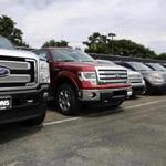 Ford Motor Co. reported a sales increase of 11 percent in July, citing demand for pickup trucks and smaller. more fuel-efficient cars. GM led the field with a 16 percent increase.