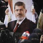 A poster of former President Mohammed Morsi was held during at a rally near Cairo on Friday.