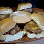 Items from the “light entrees” menu at Hit Wicket in Inman Square include potato sliders (pictured) and South African bunny chow with chicken.