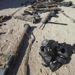 State-run medial showed weapons and gas masks, as well as corpses, at the ambush site.
