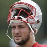 Tim Tebow looked on during a Patriots joint workout with the Eagles on Thursday.