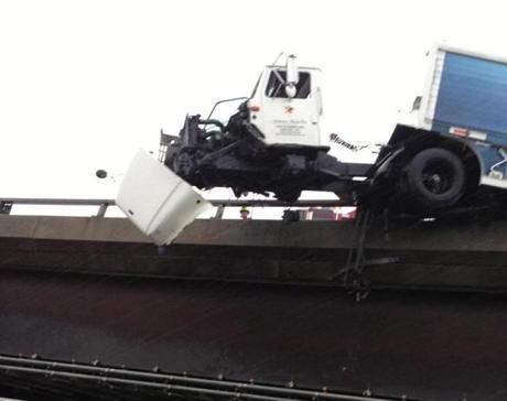 A truck has broken through the guardrail on Interstate 93 North heading out of Boston and the truck’s cab is hanging over the Leverett Connector ramp, State Police said.
