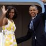 President Barack Obama and first lady Michelle Obama wave as they boarded Air Force One before heading to Orlando, Fla.