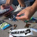 Stash Karandanis, cofounder of Tackle Grab, sorted through an array of tackle before casting his line.
