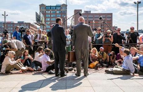 08/12/2013 BOSTON, MA Defense attorneys Hank Brennan (cq) (left) and J.W. Carney Jr. (cq) speak to the media outside the John Joseph Moakley United States Courthouse (cq) where the verdict was read in the case against James 