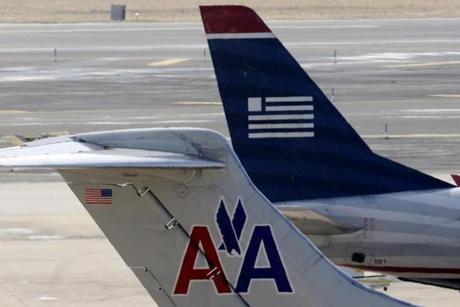 American Airlines and US Airways jets prepared for flight at the Philadelphia International Airport in February. 
