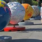 A number of globes are lined up along the Tremont Street side of the Boston Common as part of the “Cool Globes: Hot Ideas for a Cooler Planet” exhibit.