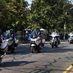 Law enforcement officers representing nine Boston-area police departments took part in a motorcycle ride through Cambridge and Boston.