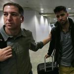 Journalist Glenn Greenwald (left) with his partner David Miranda in Rio de Janeiro's International Airport.