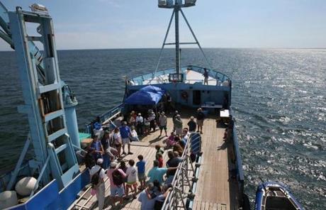 Visitors to the OCEARCH research ship listened to information about the program.
