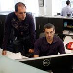 Mike Preshman (left) and Matt Manger at work at Veracode, where employees set their own vacations.