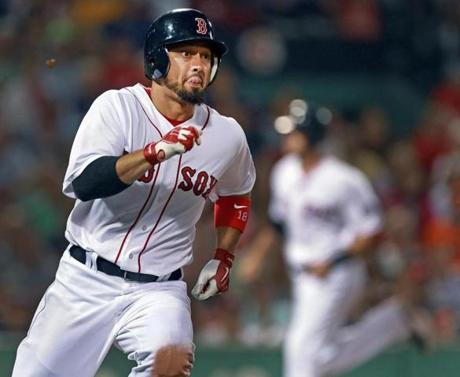 Shane Victorino watched as his two-run double fell in safely in the seventh as teammate Will Middlebrooks headed for the plate. Victorino also added two home runs.
