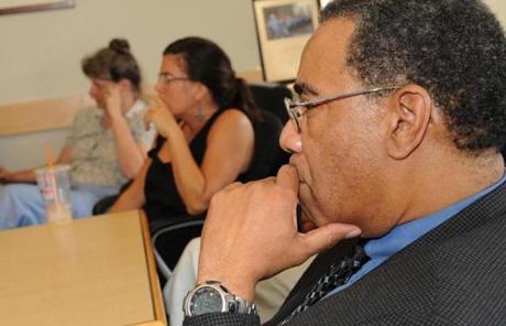 Rick Ellis and co-workers at Action for Boston Community Development listened to President Obama speak Wednesday.
