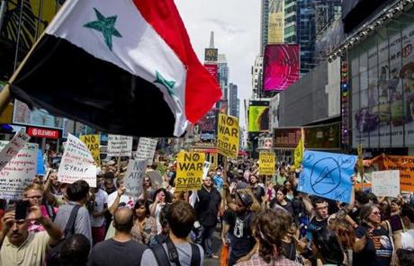 Opponents of US military action in Syria demonstrated at New York's Times Square. 
