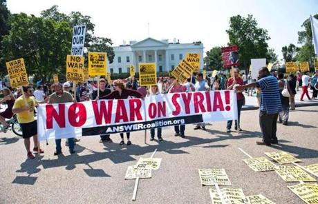 Protesters demonstrate against a US-led strike on Syria in front of the White House Saturday. 
