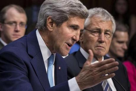 Secretary of Defense Chuck Hagel (right) listened as Secretary of State John Kerry spoke during a hearing of the Senate Foreign Relations Committee.
