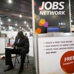 A job-seeker completed an application at a career fair in Philadelphia in July.