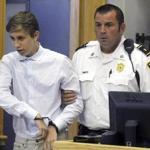 Galileo Mondol, 17, was led into a district court for a hearing on Friday in Pittsfield.