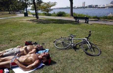 Jim Bourgeois of the South End, and Rob Tedesco of Newton caught some sunshine along the Charles River esplanade.
