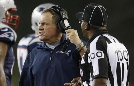 Patriots head coach Bill Belichick spoke with line judge Tom Symonette.
