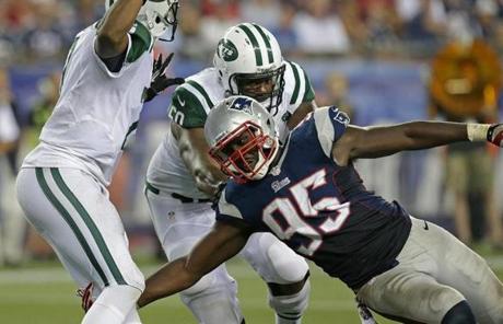Patriots defensive end Chandler Jones wrapped up Jets quarterback Geno Smith for the second of his two sacks in the first half.
