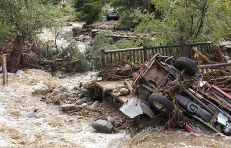 Flooding on Gold Run Creek north of Boulder, Colo., took out homes and cars.
