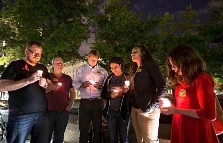 The candlelight vigil was in Washington’s Freedom Plaza.
