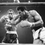 Ken Norton (left) fights Muhammad Ali in 1973, their second of three bouts. (AP Photo/File)