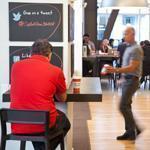 Capital One runs a cafe-style office in San Francisco. Employees serve up coffee and advice.