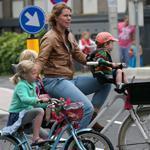 In the Netherlands, almost no one rides with a helmet, and families pedal along without worry about cars.