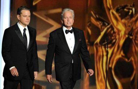 Matt Damon (left) and Michael Douglas walked onto the stage and later introduced Elton John for his performance.
