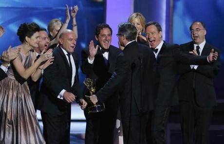 Cast and crew, including Cranston (center, right), cheered executive producer Vince Gilligan after he accepted the award.
