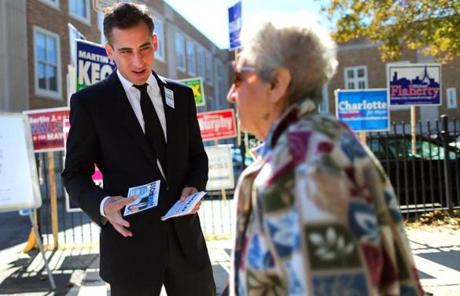 Mayoral candidate Michael Ross greeted a voter outside  the Curley School in Jamaica Plain.
