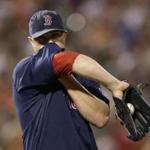 Red Sox starting pitcher Jon Lester wiped sweat from his face between pitches during the second inning.