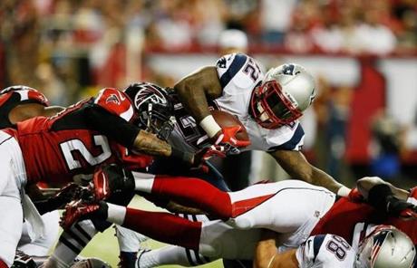 Stevan Ridley was tackled by Thomas DeCoud.
