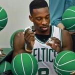 Jeff Green signed green basketballs during Media Day.