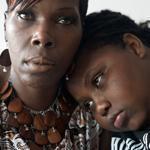 “I used to say, ‘I’m gonna kill this guy, whoever he is. He’s gonna pay.’ But I know it wouldn’t make me feel better,” said Amani, (shown with his mother, Audrey) who lost his brother to a shooting seven years ago.