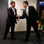 Mayoral candidates Marty Walsh (left) and John Connolly shook hands Wednesday as they crossed paths at a Boston school.