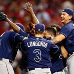 Evan Longoria and his Rays teammates begin the celebration following the final out in their wild-card victory over the Indians.