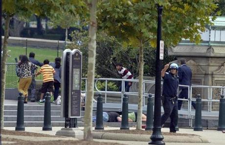 People took cover after gunshots were heard at the US Capitol on Tuesday. 
