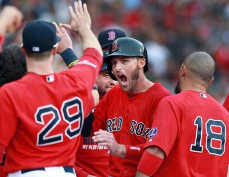 Stephen Drew (center) was pumped as the Red Sox welcomed him to the dugout after scoring in the fourth inning.
