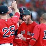 Stephen Drew (center) was pumped as the Red Sox welcomed him to the dugout after scoring in the fourth inning.