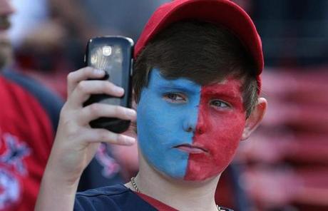 A fan took a photograph before the game at Fenway Park.
